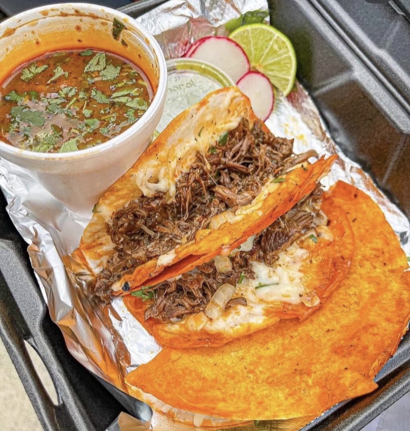 Crispy birria tacos with melted cheese and consommé